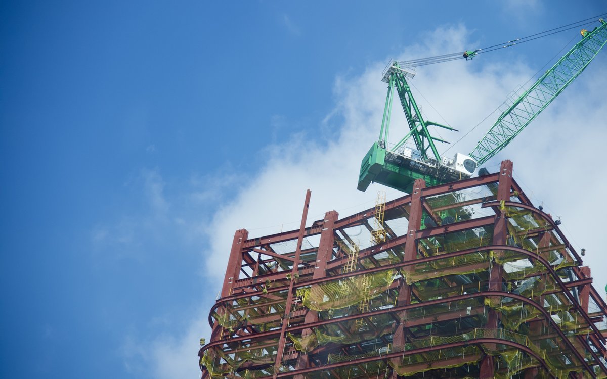 Construction workers on a structural steel frame at a high-rise site