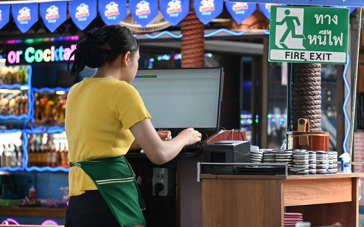 Point-of-sale counter at a busy multi-outlet restaurant