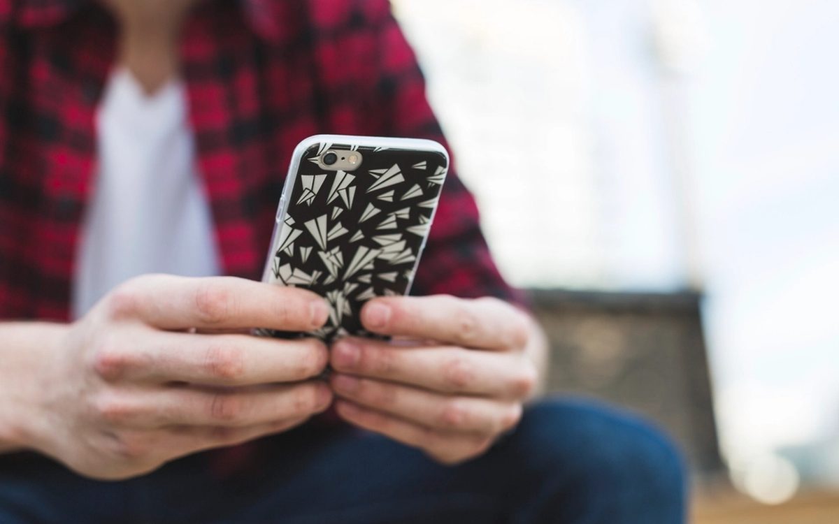 Person checking a wellness tracking app on a smartphone